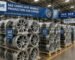 A batch of SAE-compliant alloy wheels ready for export at a Chinese factory warehouse