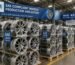 A batch of SAE-compliant alloy wheels ready for export at a Chinese factory warehouse